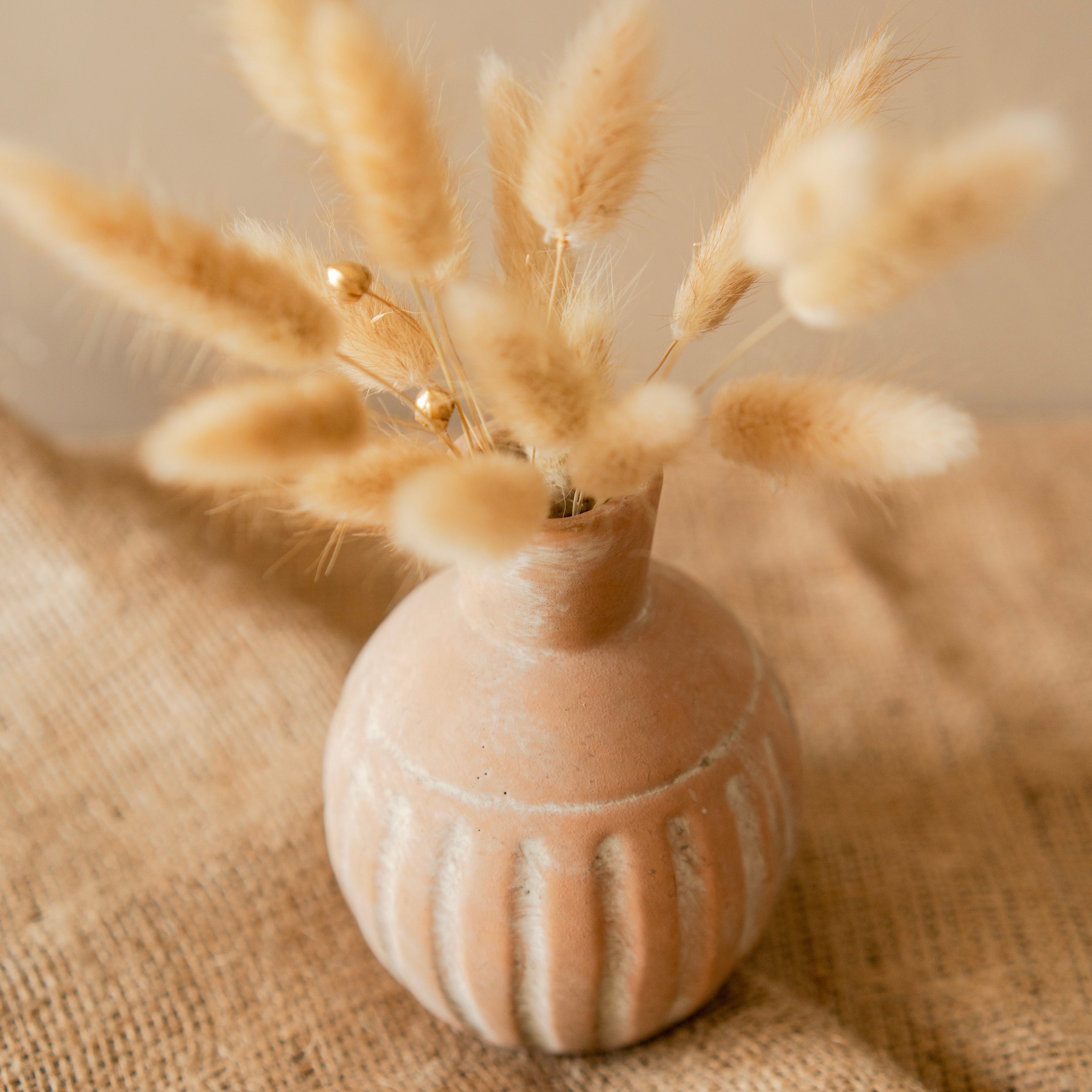 Rustic vase with bunny tails