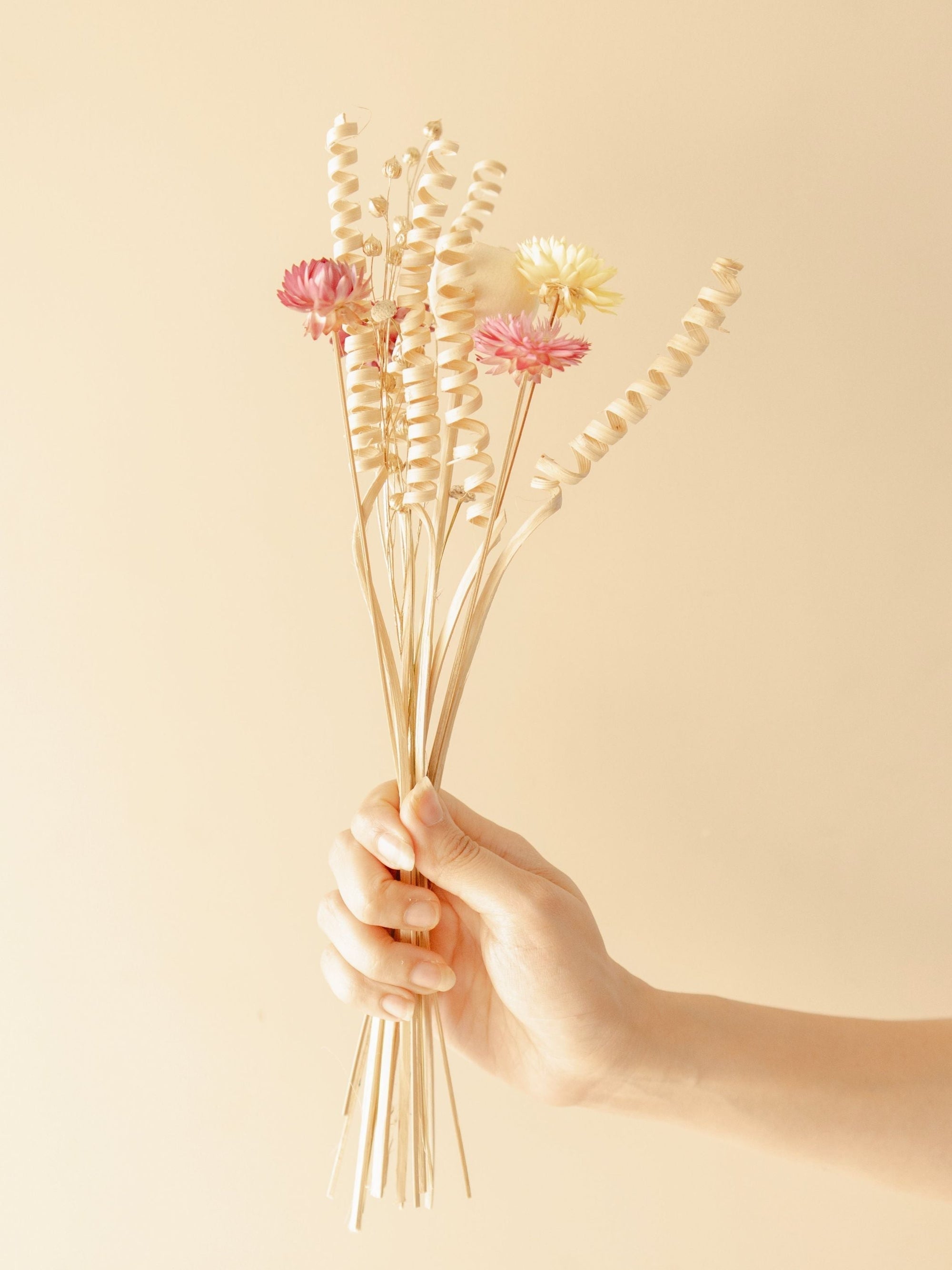 The Earthly vase with dried flower bunch