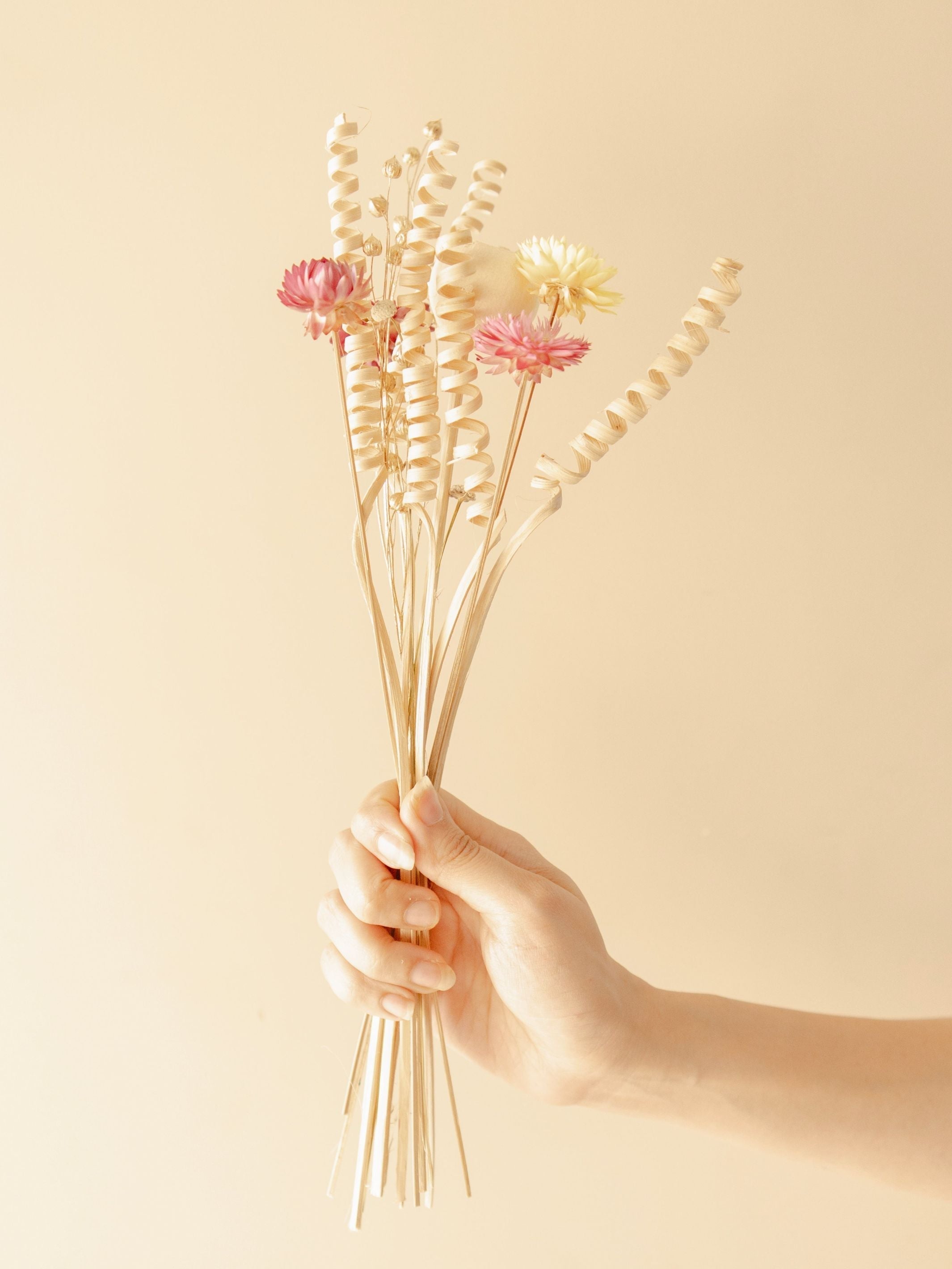 The Earthly vase with dried flower bunch