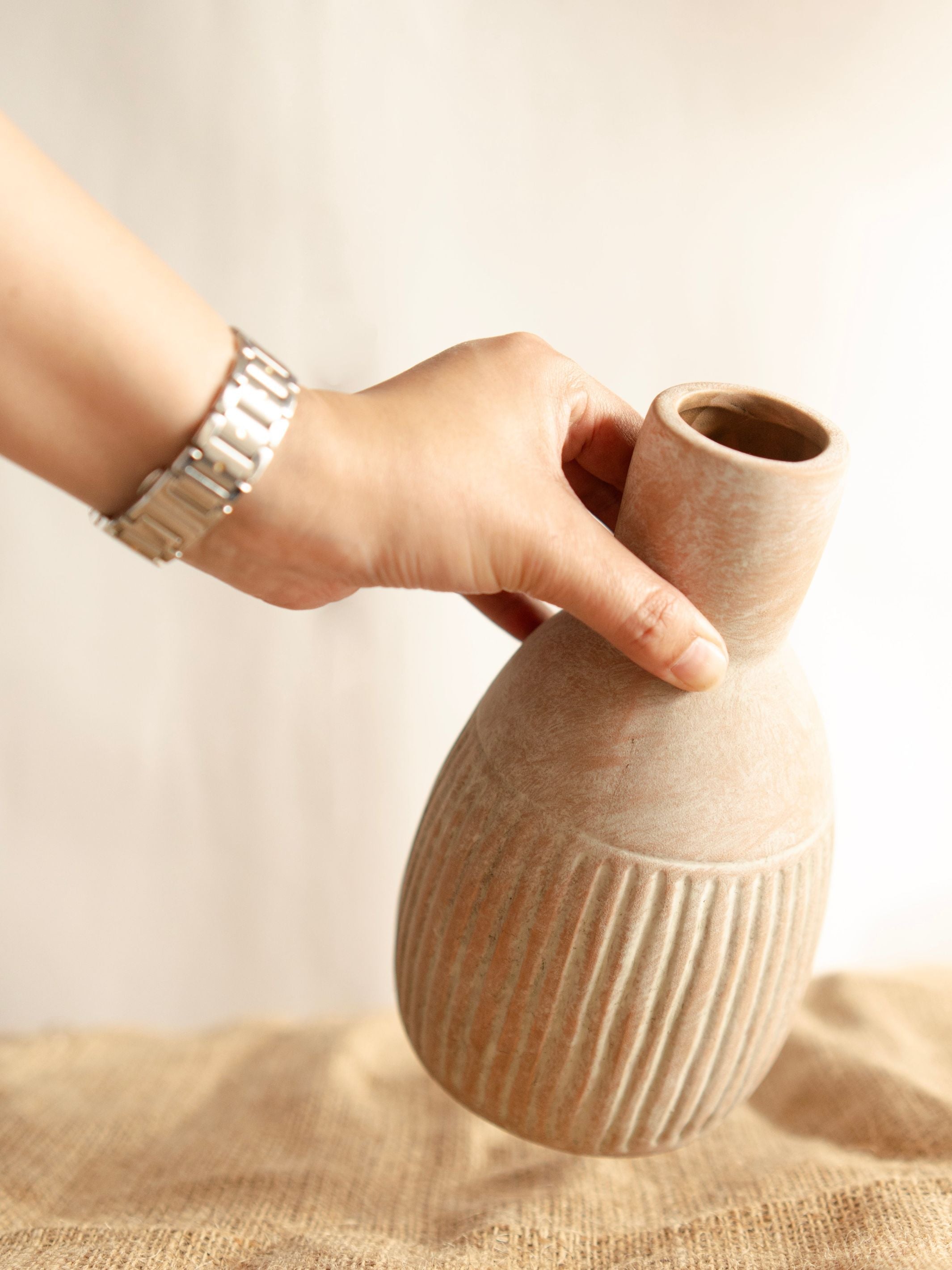 The Earthly vase with dried flower bunch