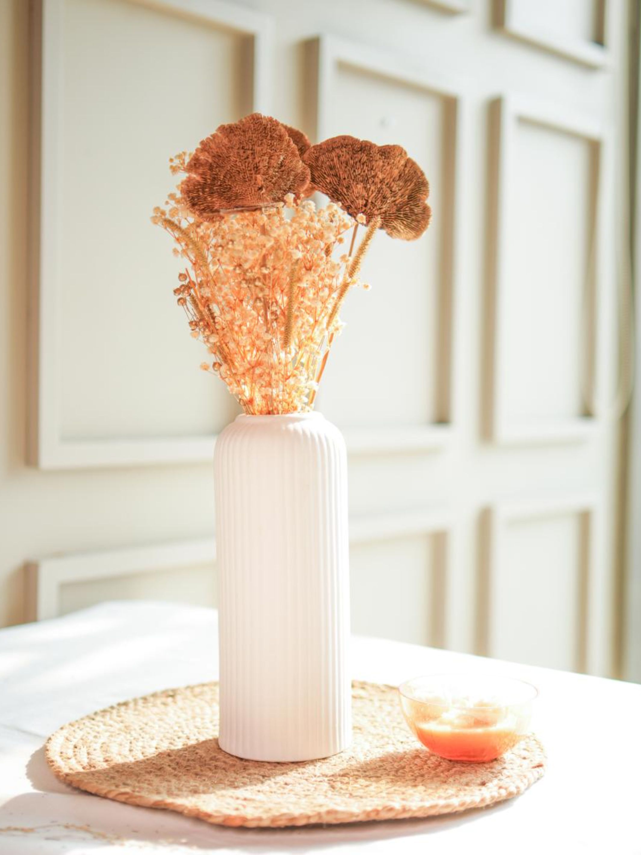 Golden harvest bunch with snow white vase