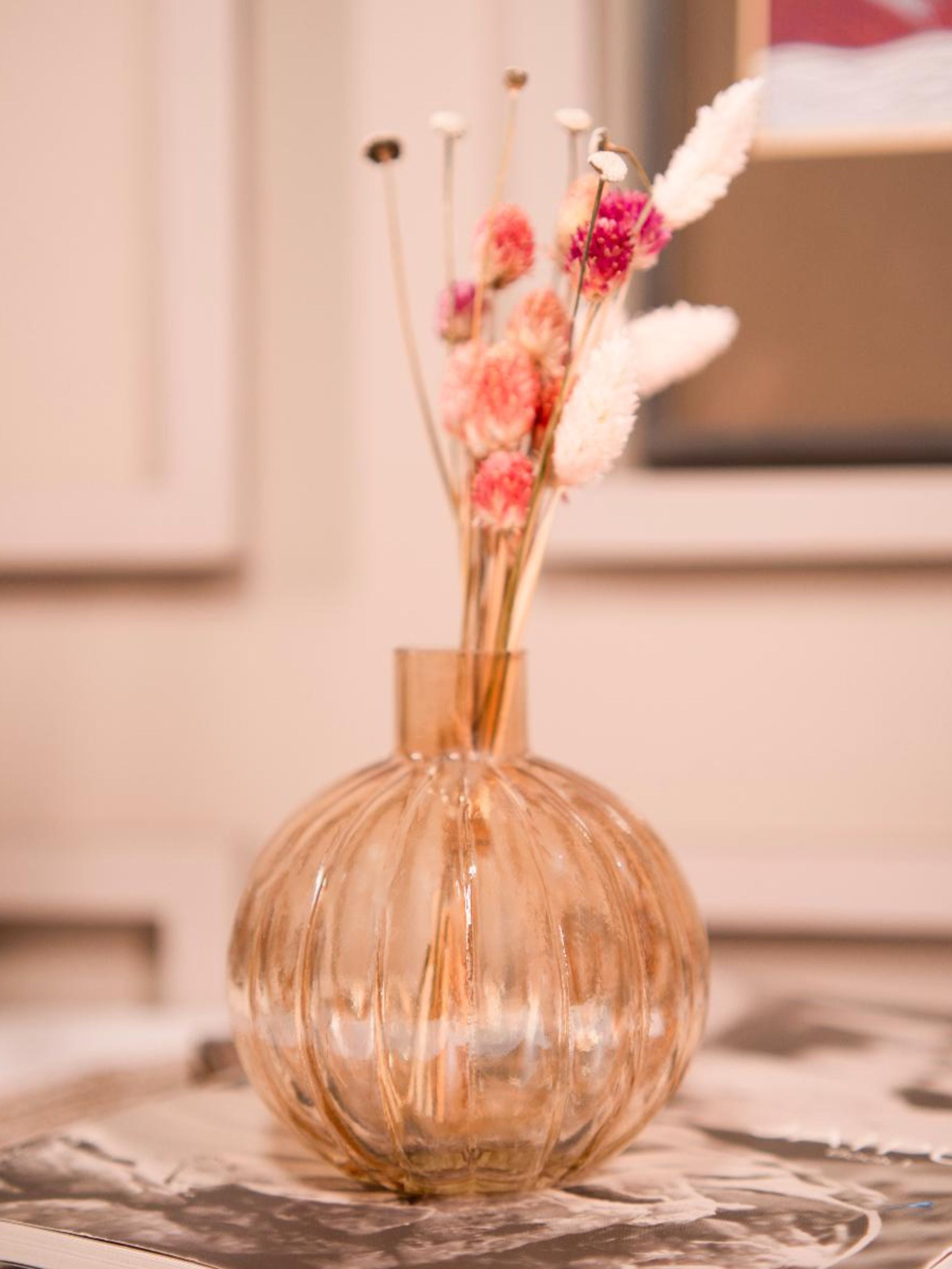 Pumpkin vase with dried flower bunch