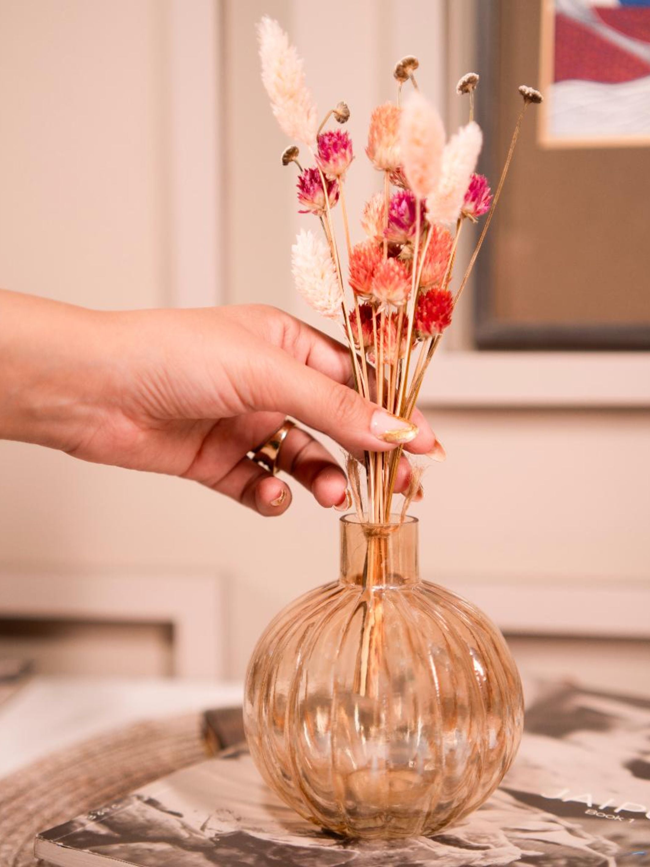 Pumpkin vase with dried flower bunch