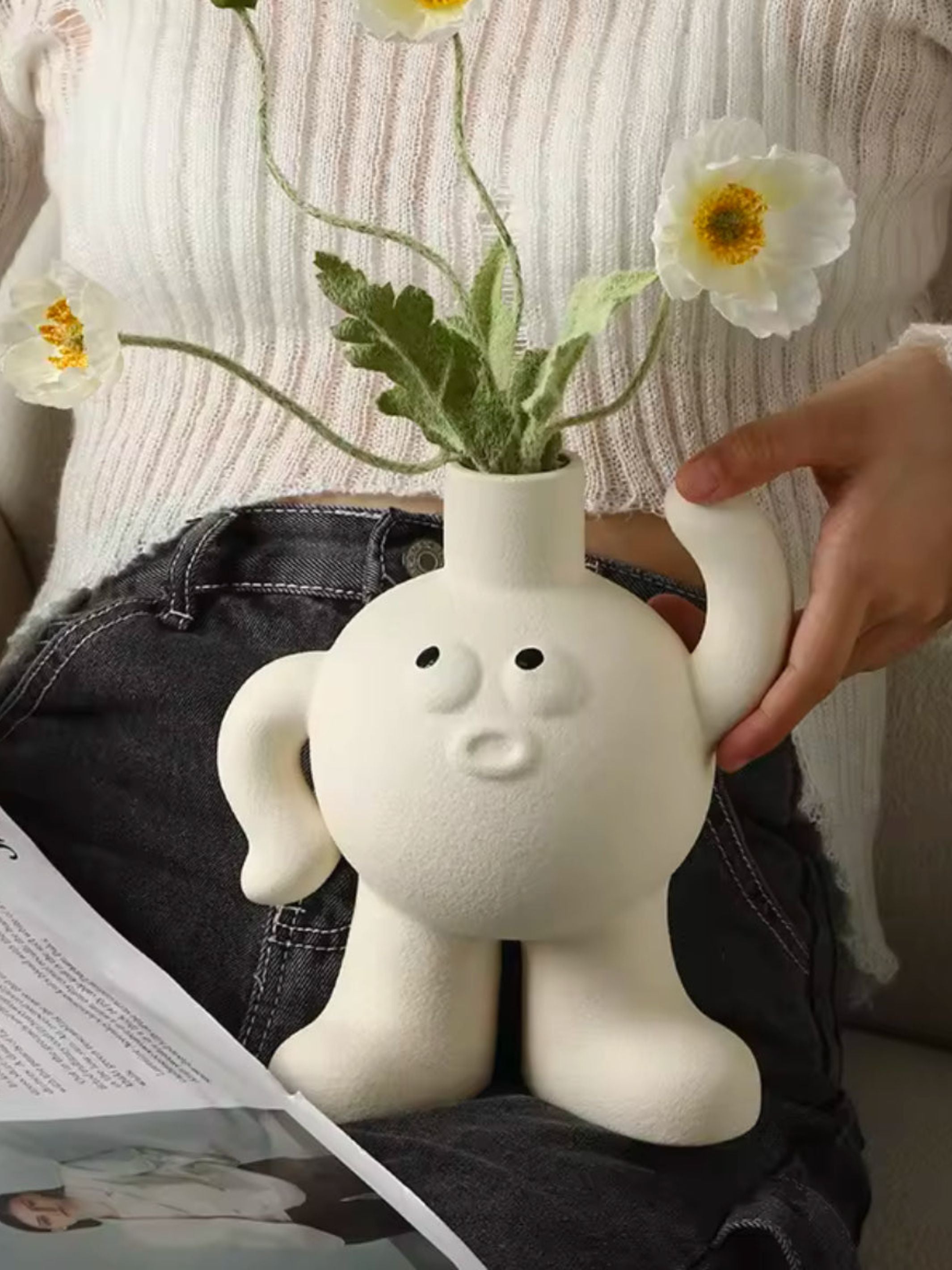 Big feet Flower vase scratching the head