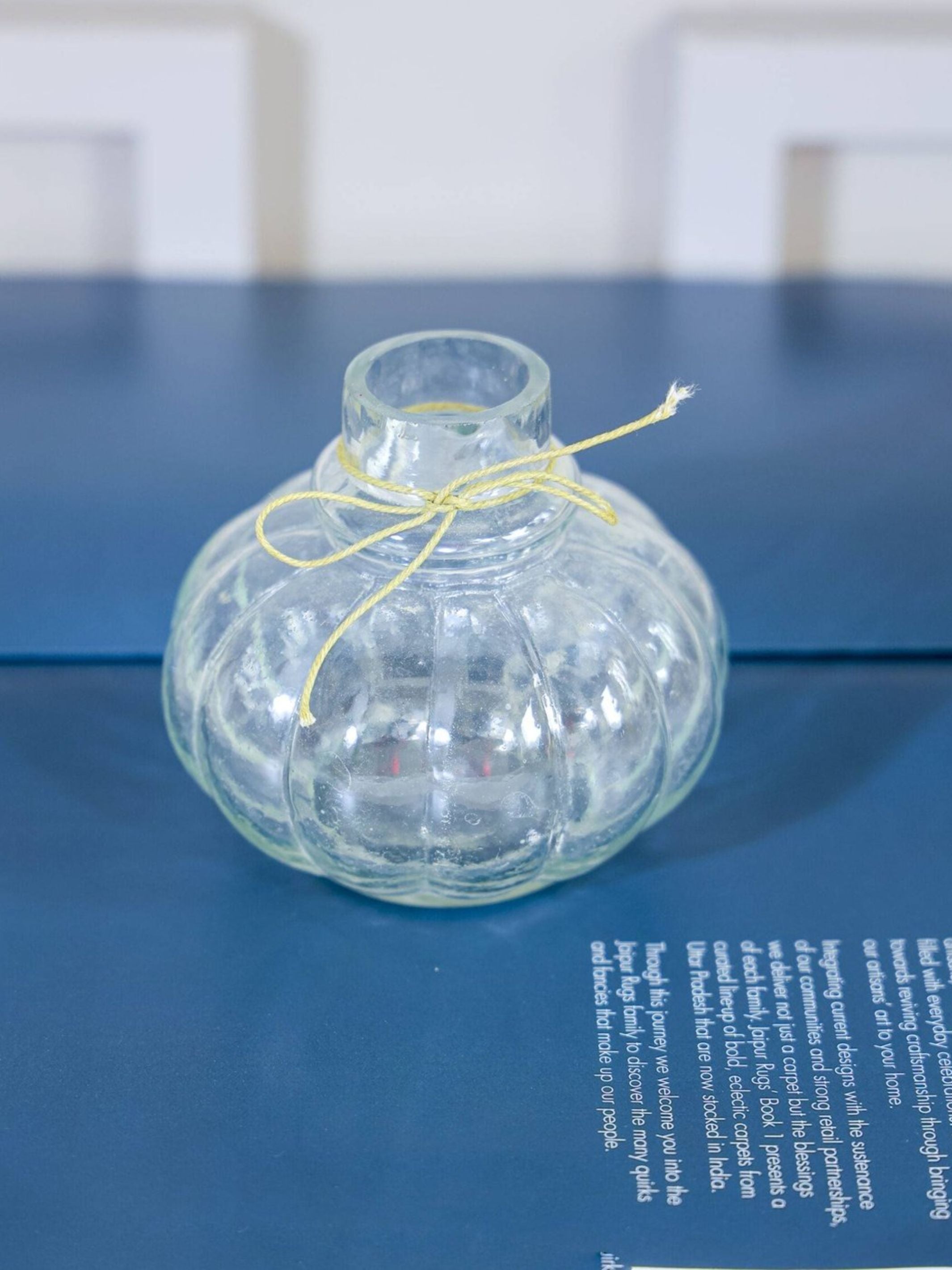 Mini glass bottle vase with red velvet bunch