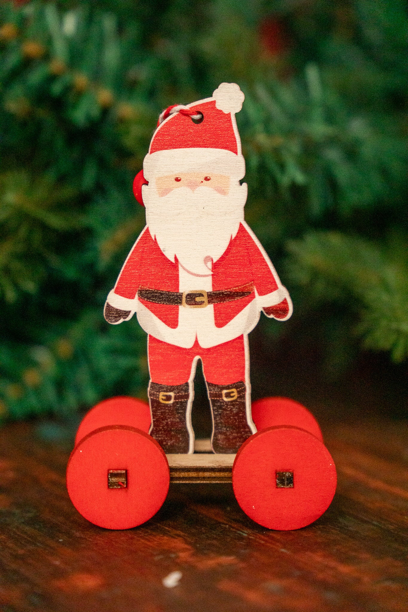 Wooden Santa on Wheels Christmas Ornament set of 4