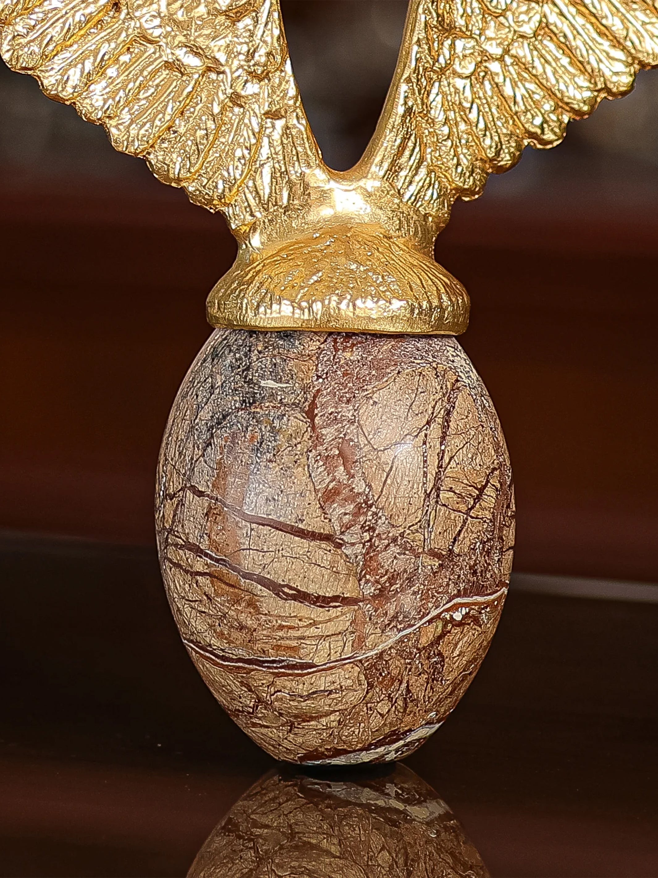 Golden Fyling Egg Sculpture