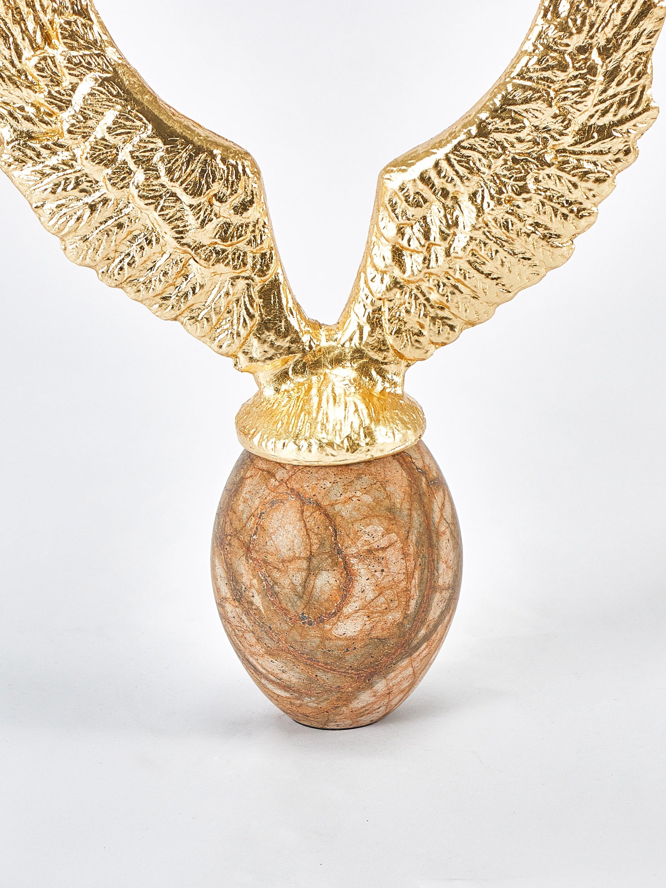 Golden Fyling Egg Sculpture