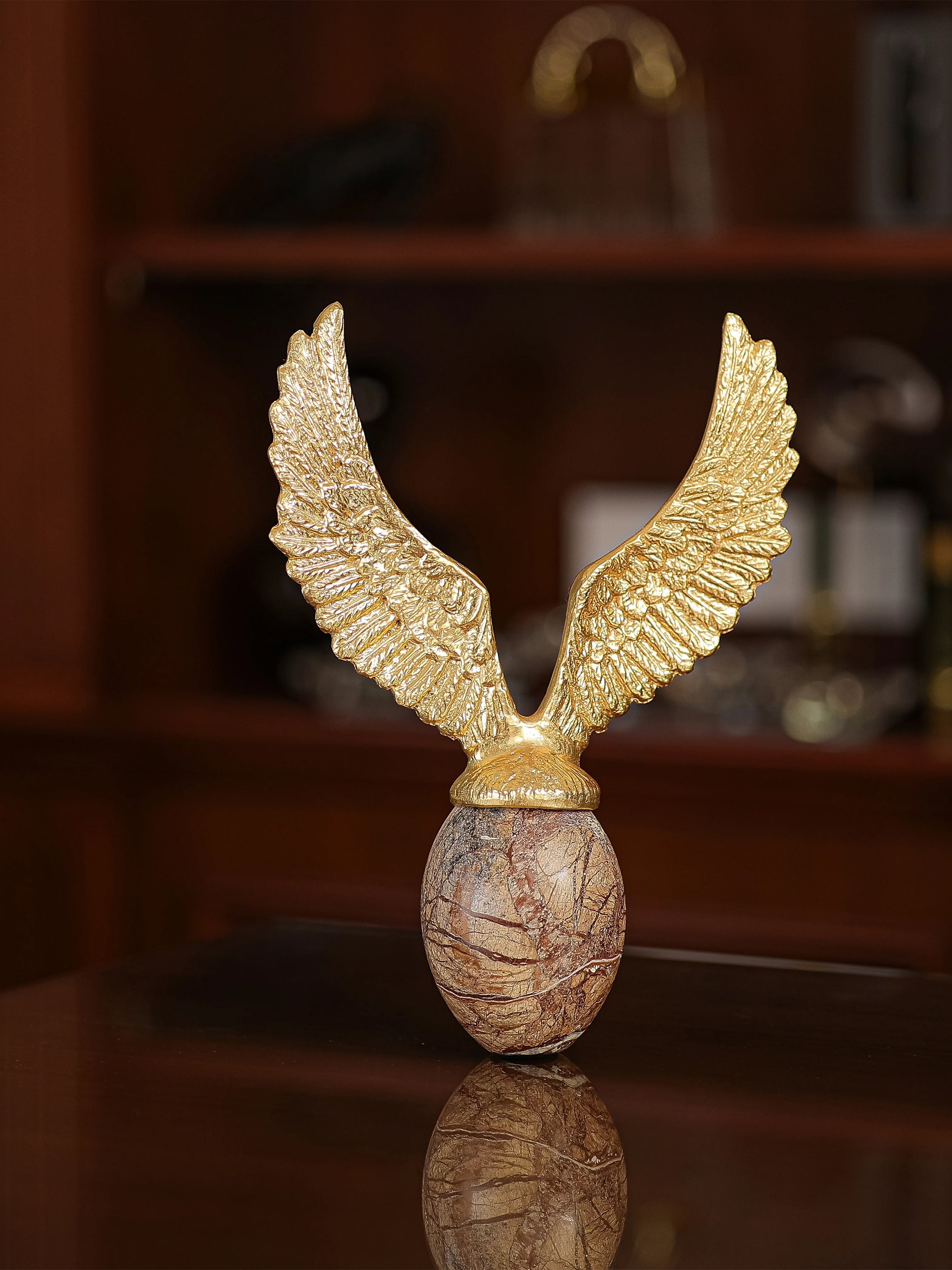 Golden Fyling Egg Sculpture