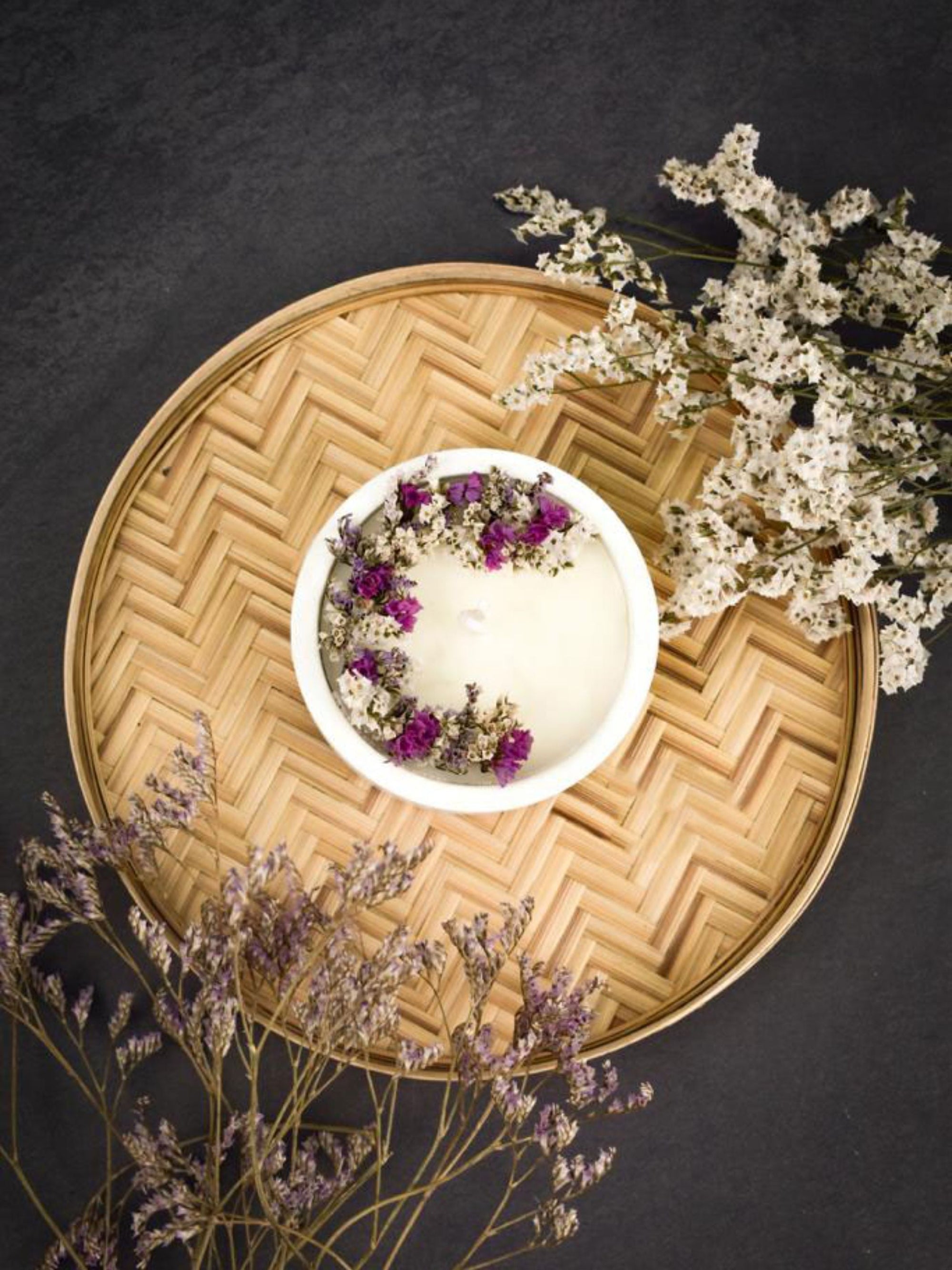 Soy Scented White Candle With White Dry Flowers On Top In A Concrete Jar