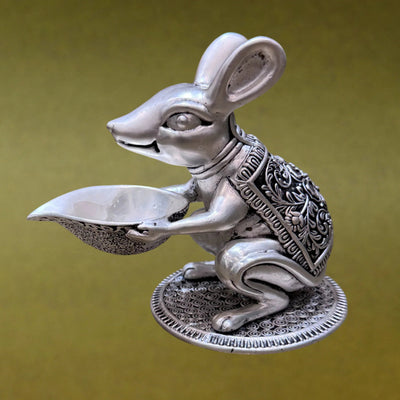 Ornate silver mouse statue holding bowl, decorative Sabera home decor on green background