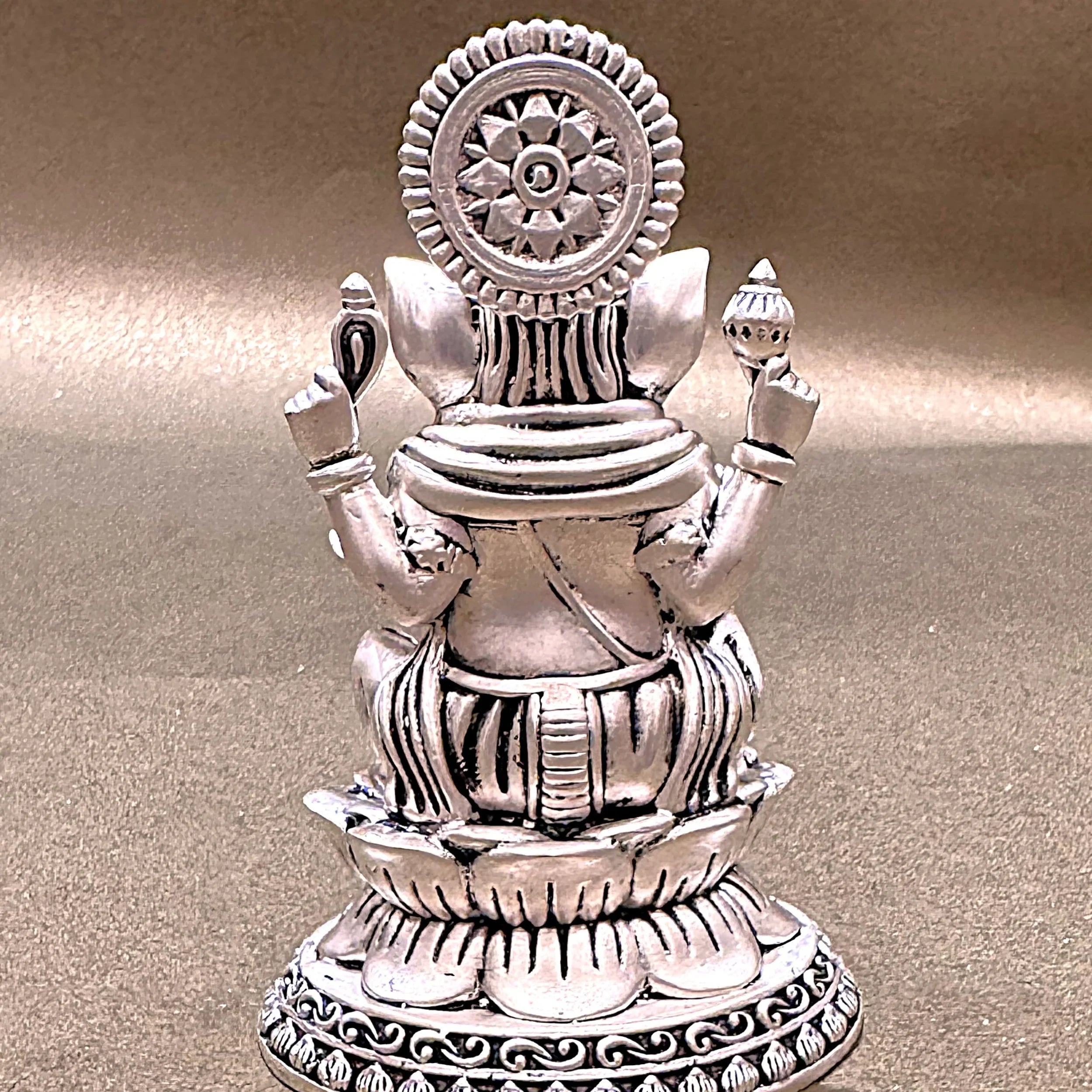 Silver Hindu deity statue on lotus pedestal, intricate detailing, Sabera home decor