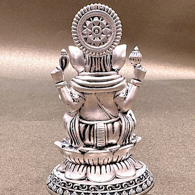 Silver Hindu deity statue on lotus pedestal, intricate detailing, Sabera home decor