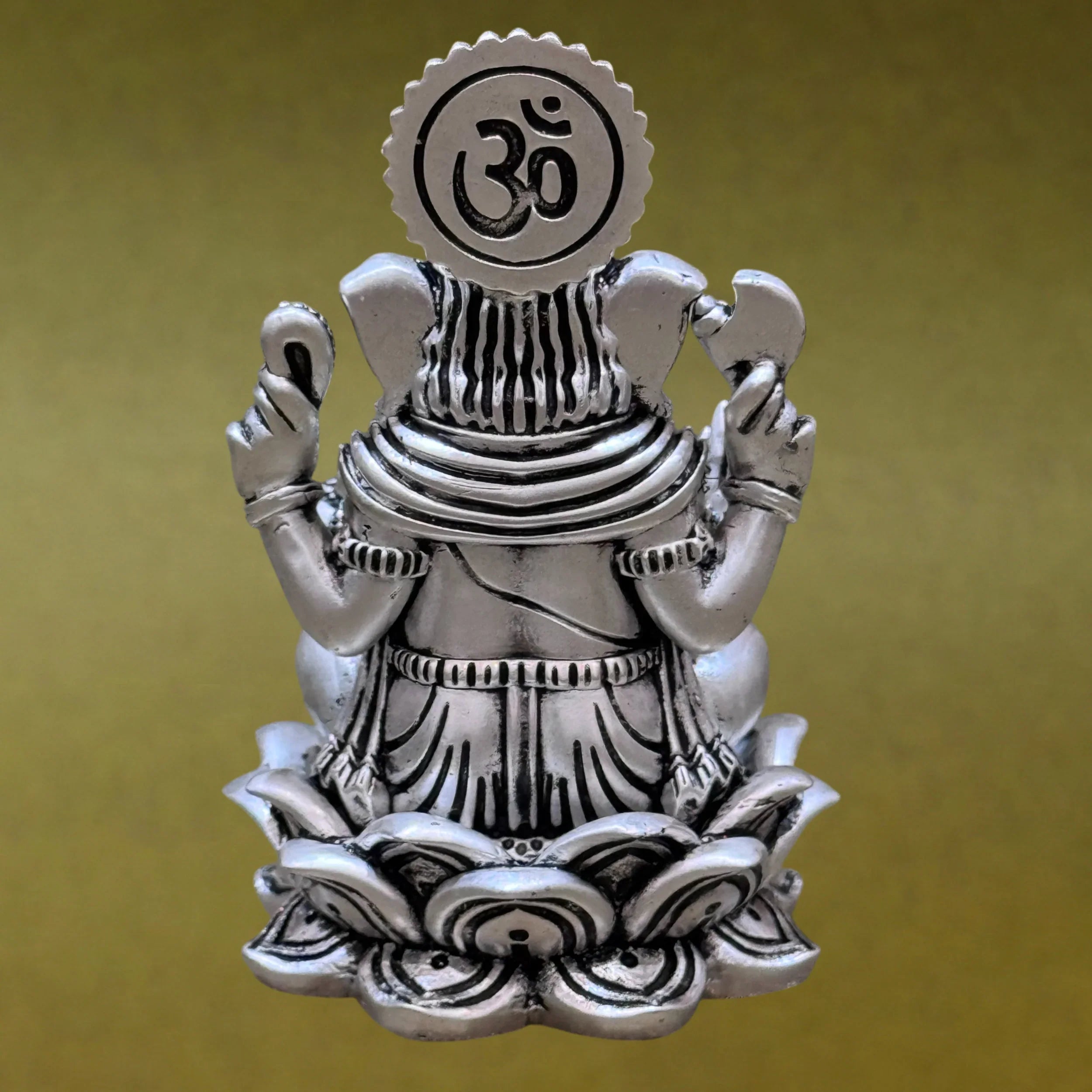 Silver Ganesh idol with Om symbol, seated on lotus, Sabera spiritual decor
