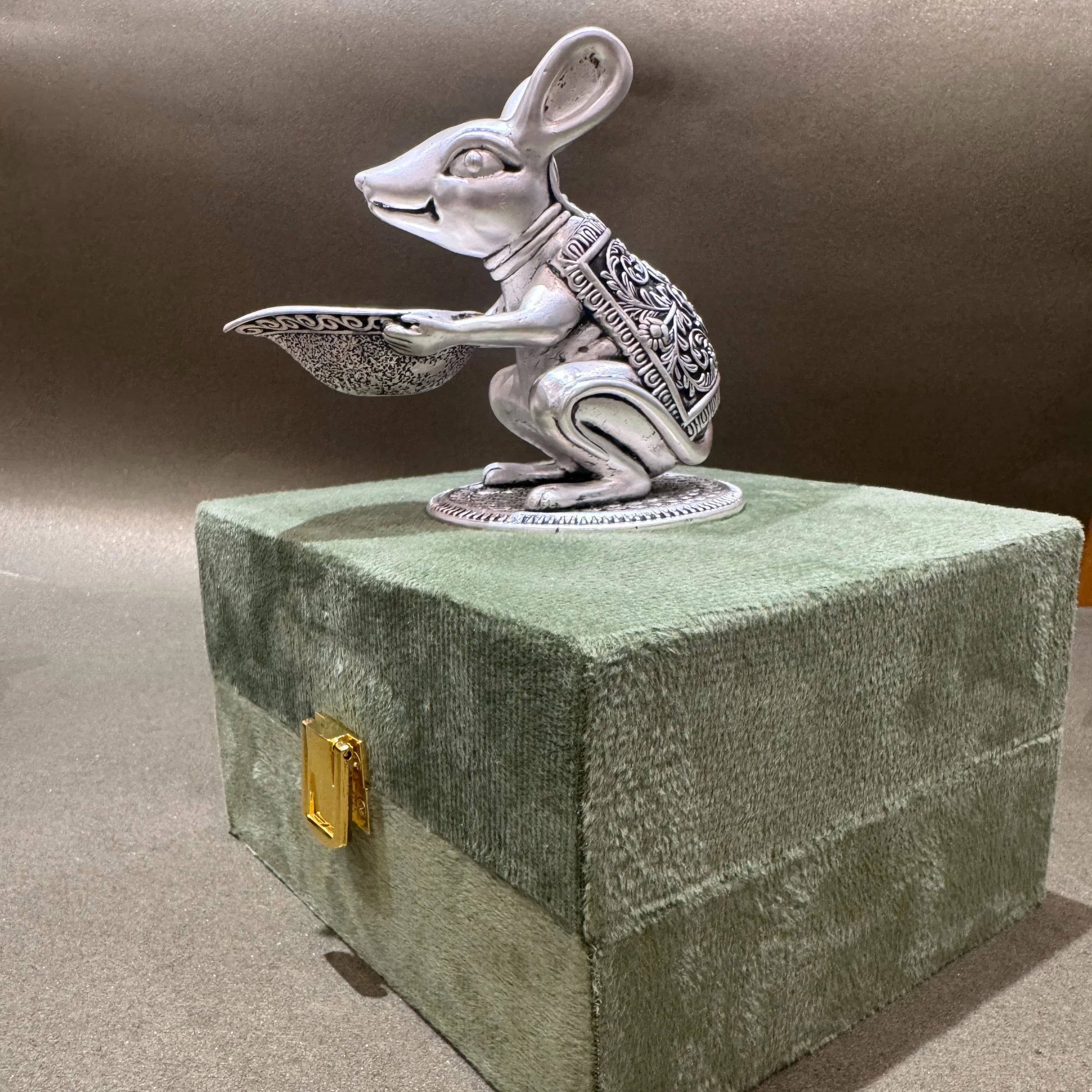 Decorative silver mouse idol on ornate green box, Sabera home decor product photography
