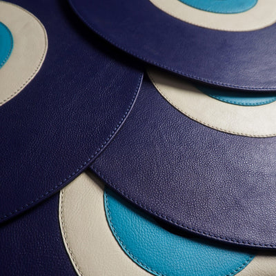 Evil eye leather mats on table India - The Mage Home