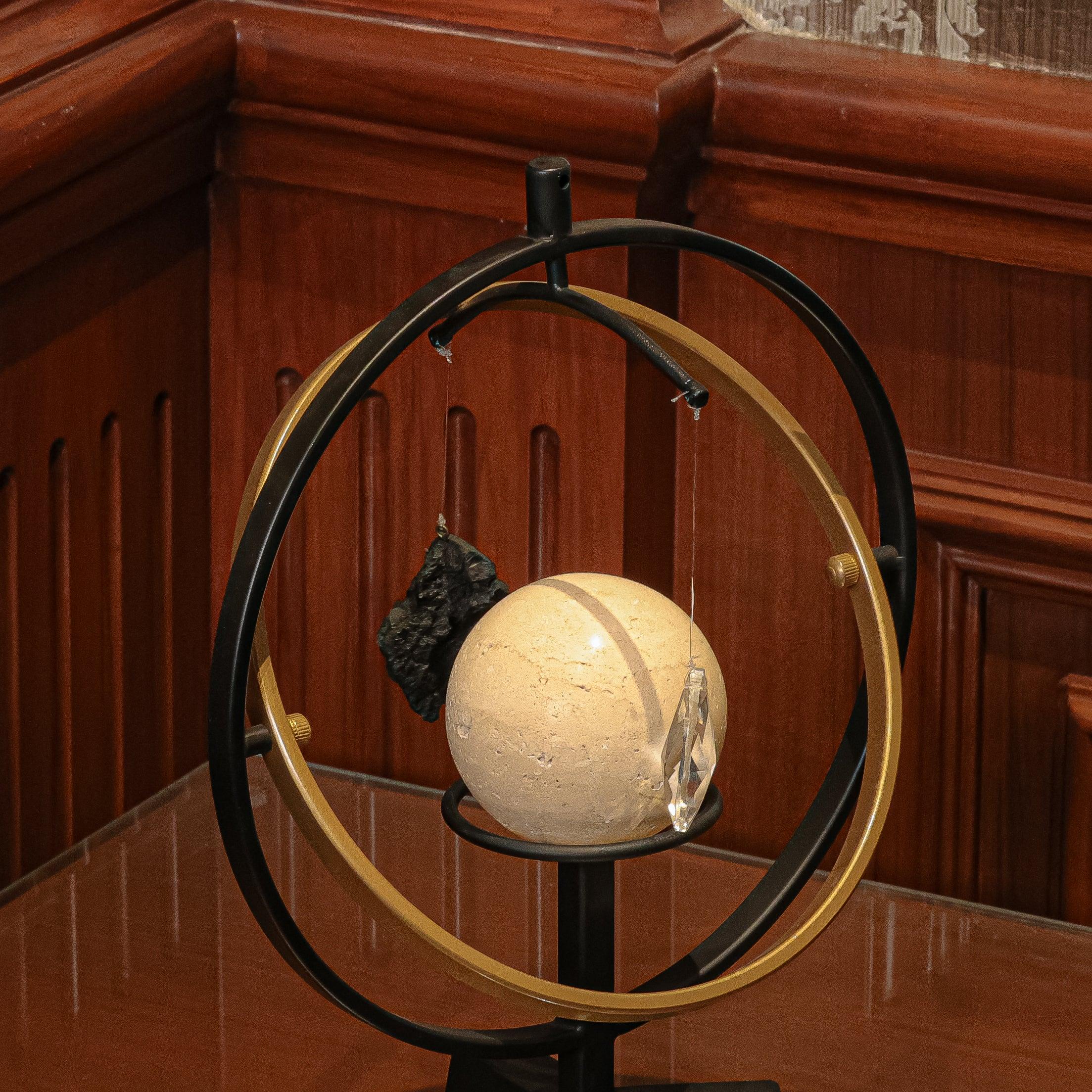 Marble Sphere And The Hanging Stone