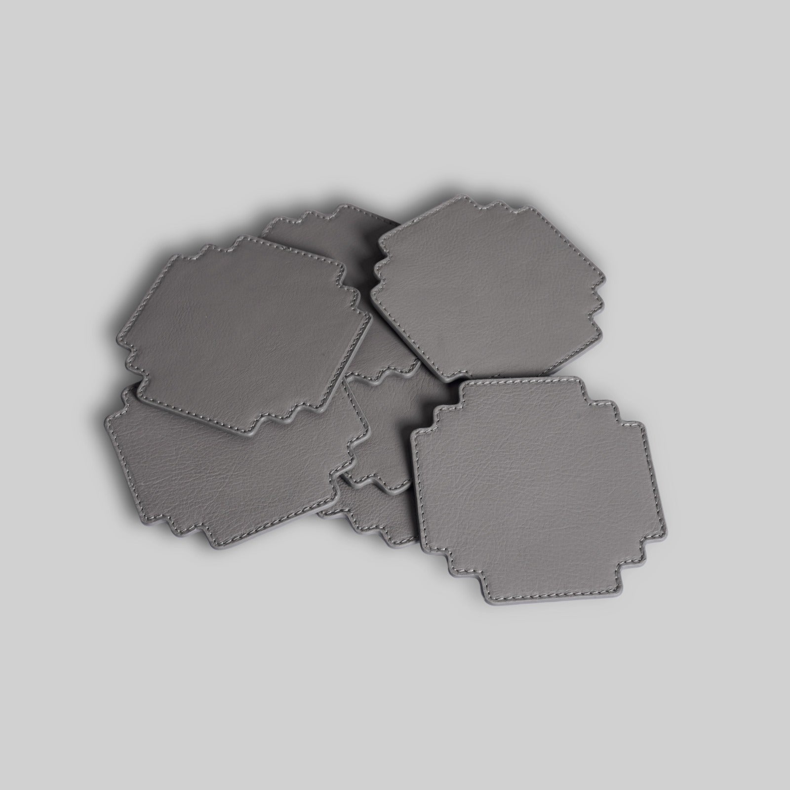 Grey leather gaming coasters stacked view India - The Mage Home