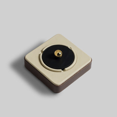 Grey leather ashtray close up brass knob detail India - The Mage Home