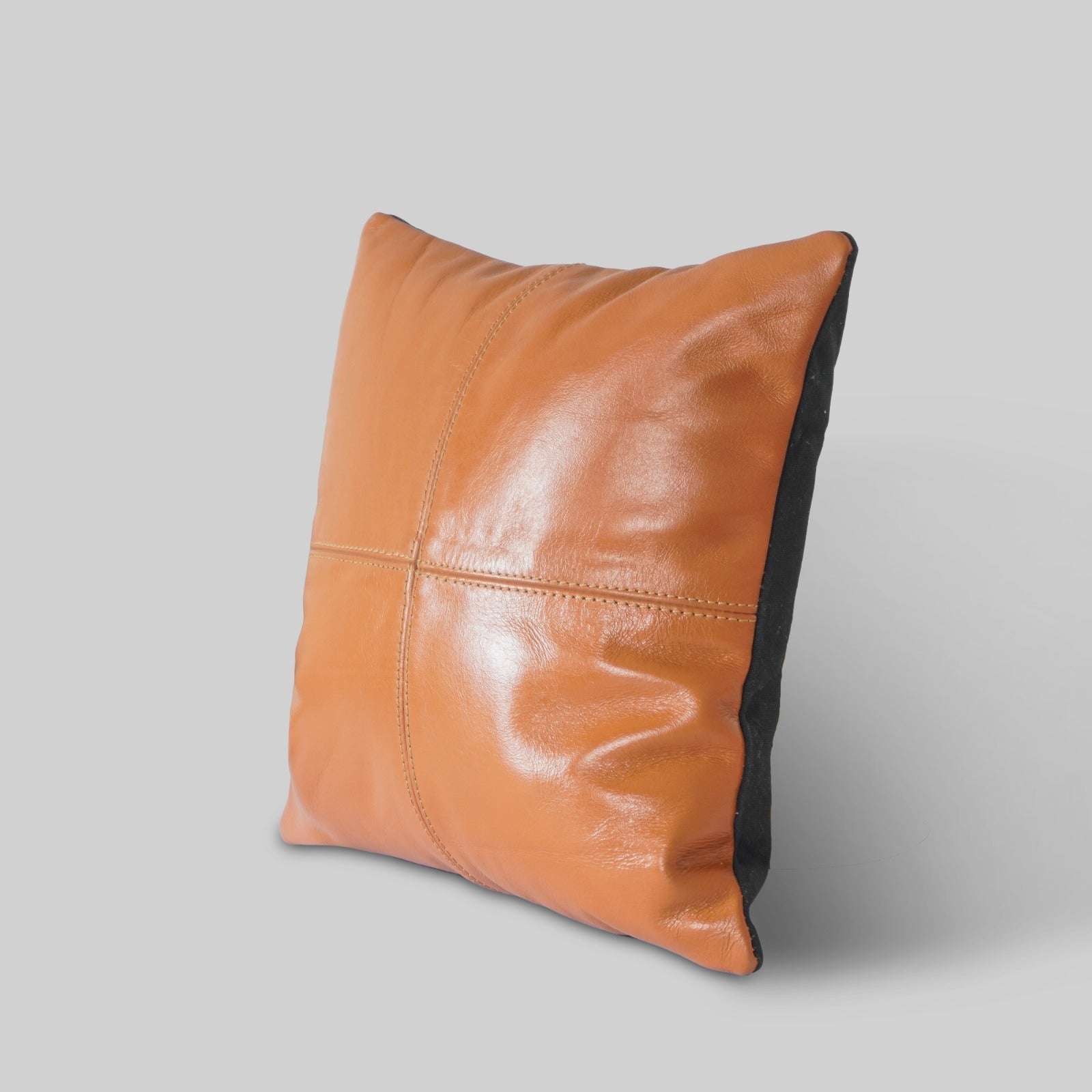 Handcrafted leather cushion small size styled on sofa
