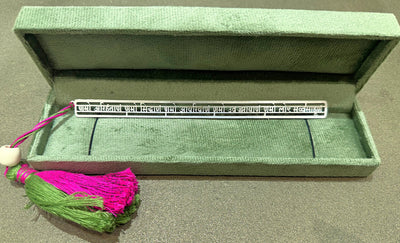 Silver Sanskrit bookmark with green and pink tassel in a green velvet box, Sabera store