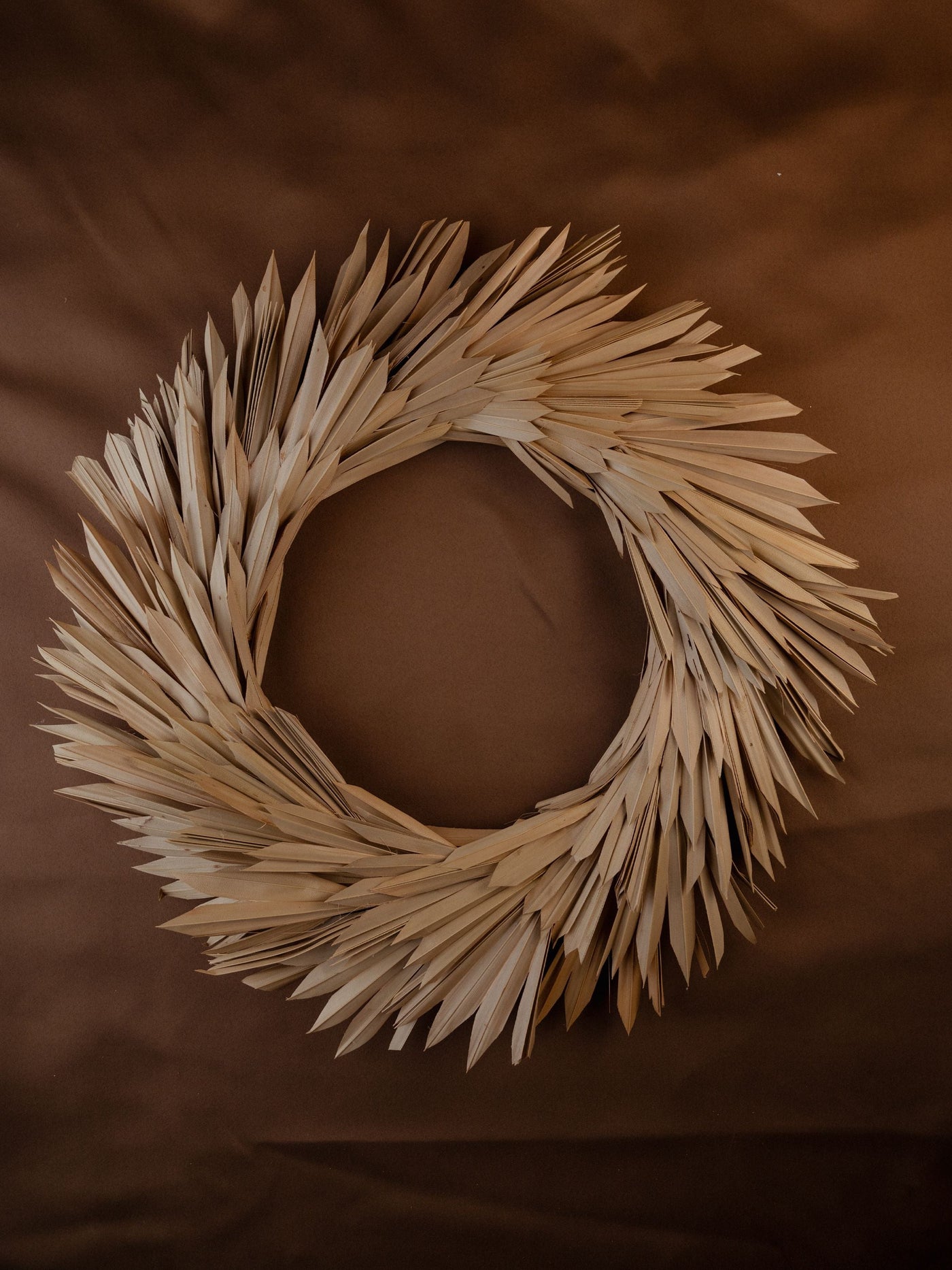 Christmas wreath made with dried palm leaves