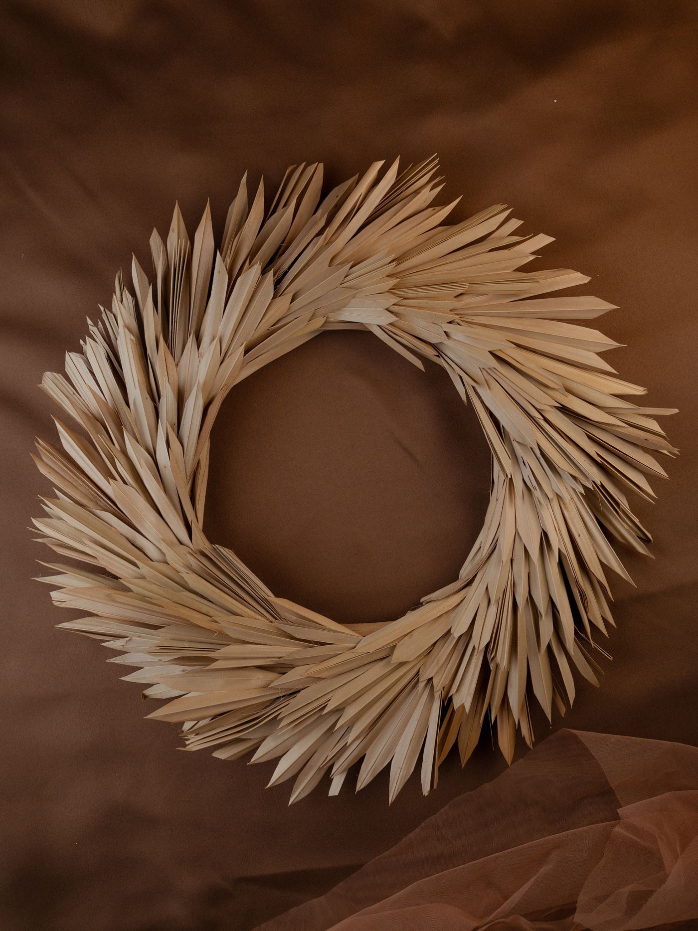 Christmas wreath made with dried palm leaves