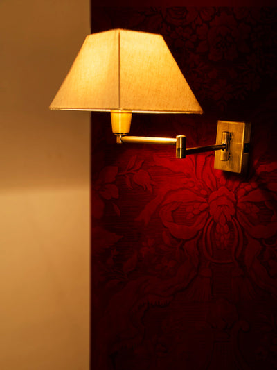 Classy Swivel 2 Arm Antique Brass Bedside Wall Light with Trapezoid Shade