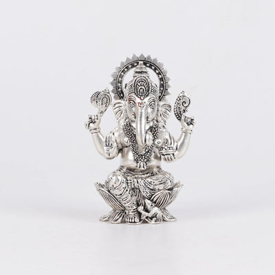 Silver plated Ganesh Ji idol on lotus with intricate detailing, featured by Sabera