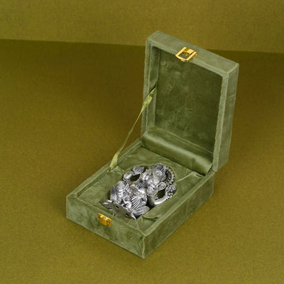 Silver plated Ganesh idol on lotus in a green velvet box, Sabera gift item