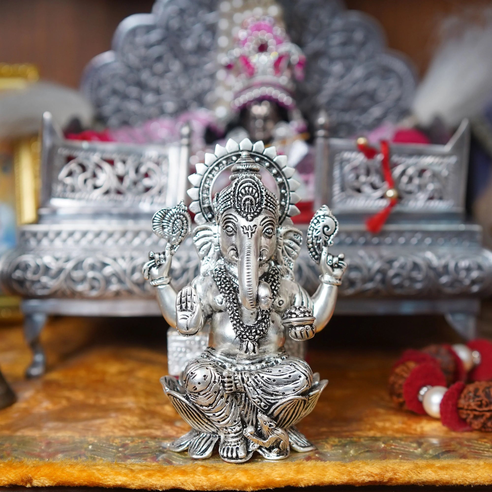 Silver plated Ganesh idol on lotus in ornate setting, Sabera home decor product