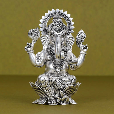 Silver plated Ganesh idol seated on lotus, detailed finish, Sabera home decor