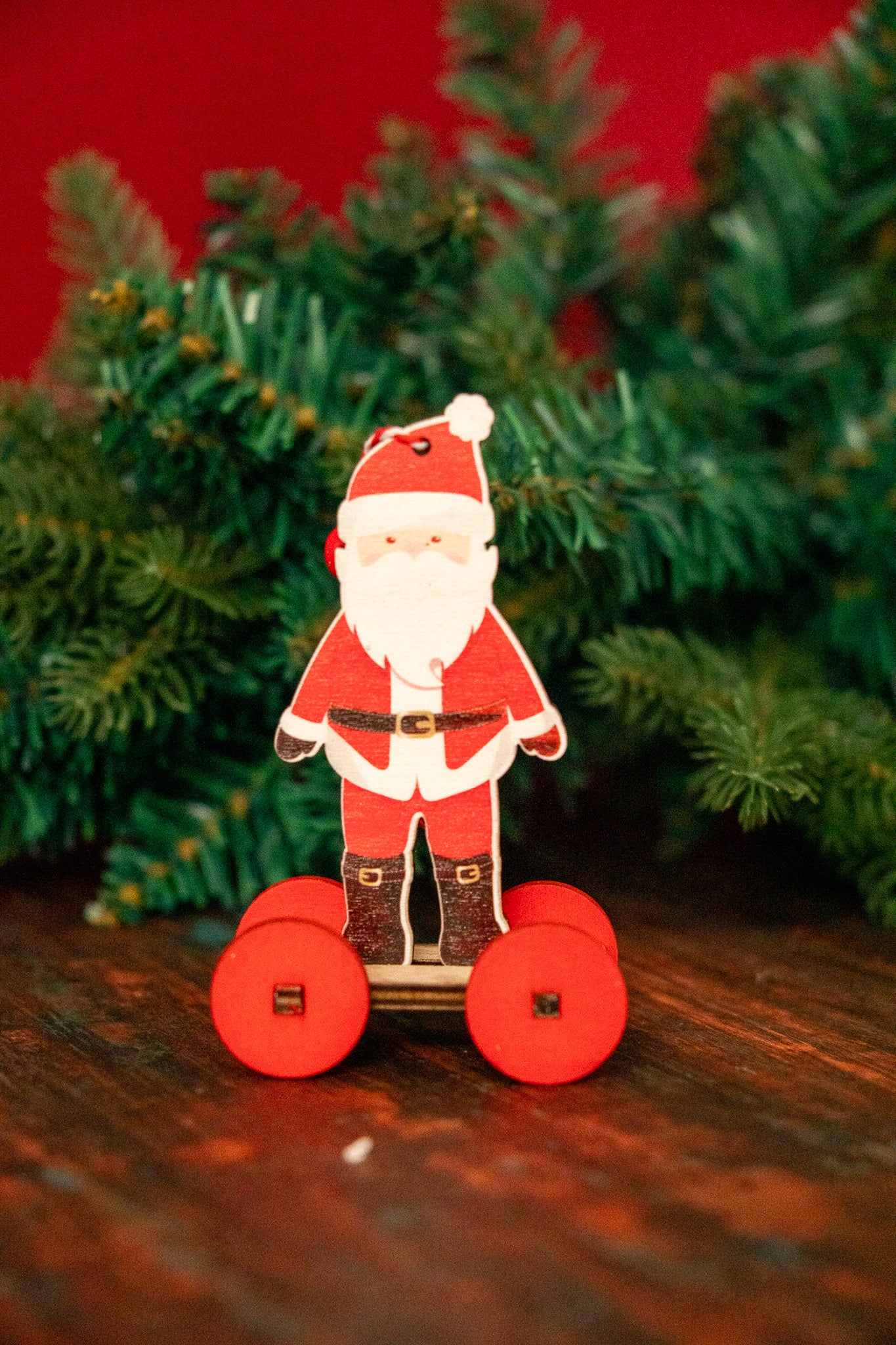 Wooden Santa on Wheels Christmas Ornament set of 4