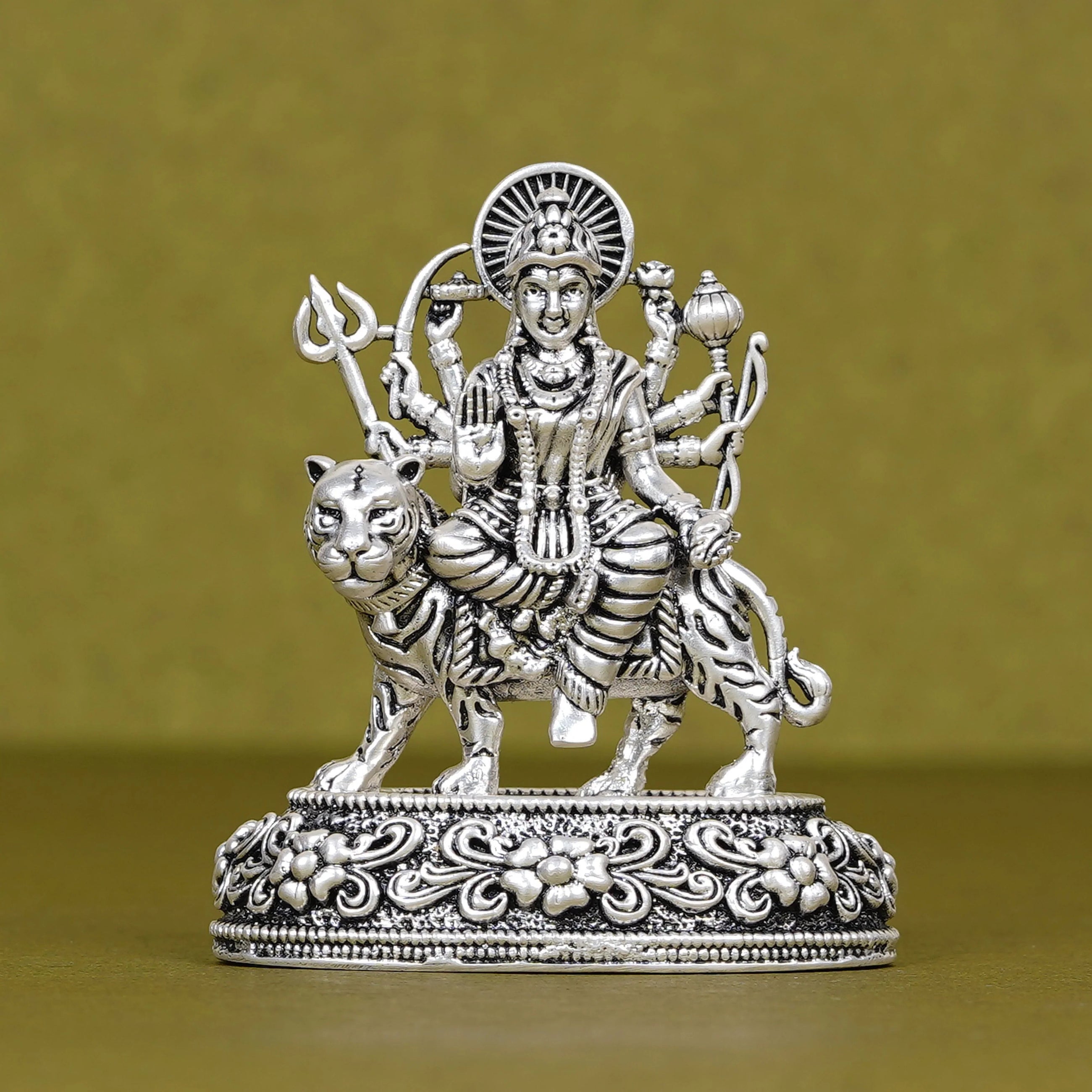 Silver Durga idol riding tiger on ornate base, car dashboard decor, Sabera store product