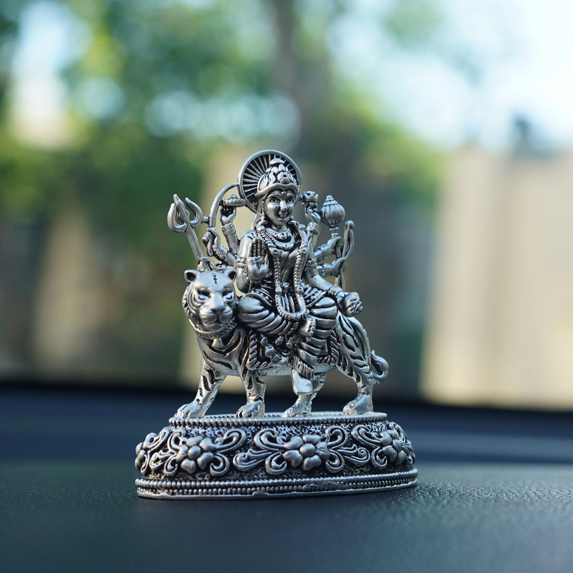 Silver Durga idol on tiger, detailed car dashboard decor, Sabera store product