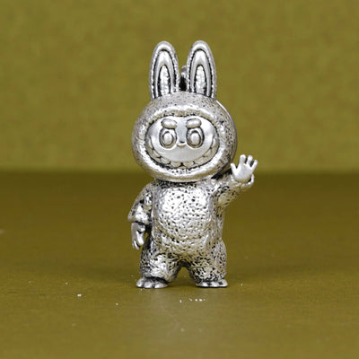 Elegant silver plated Labubu 3D keychain figurine with bunny ears on a plain background