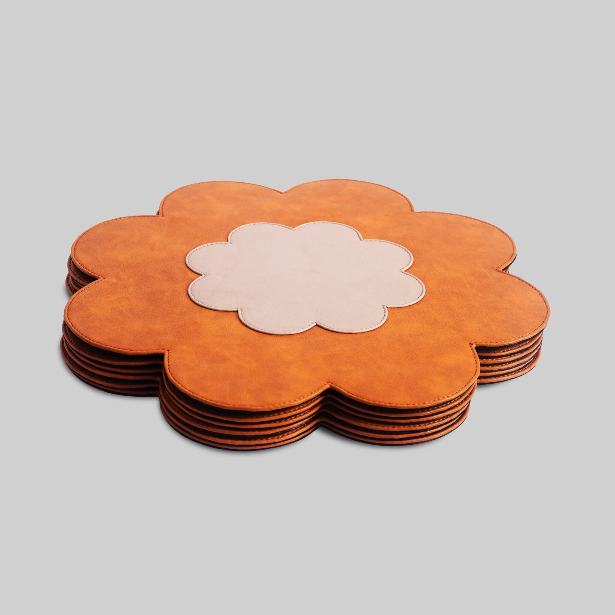 Leather floral table mats displayed on dining table India - The Mage Home
