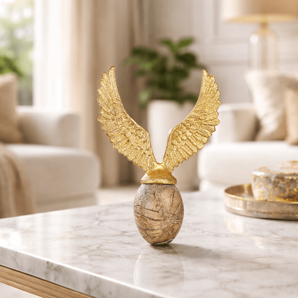 Golden Fyling Egg Sculpture