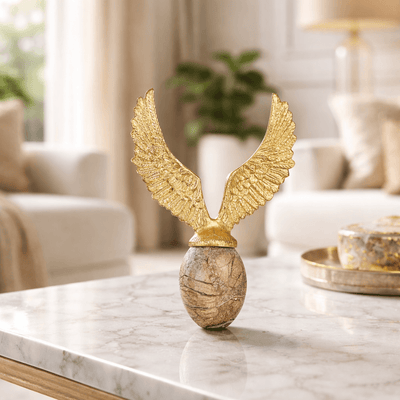 Golden Fyling Egg Sculpture