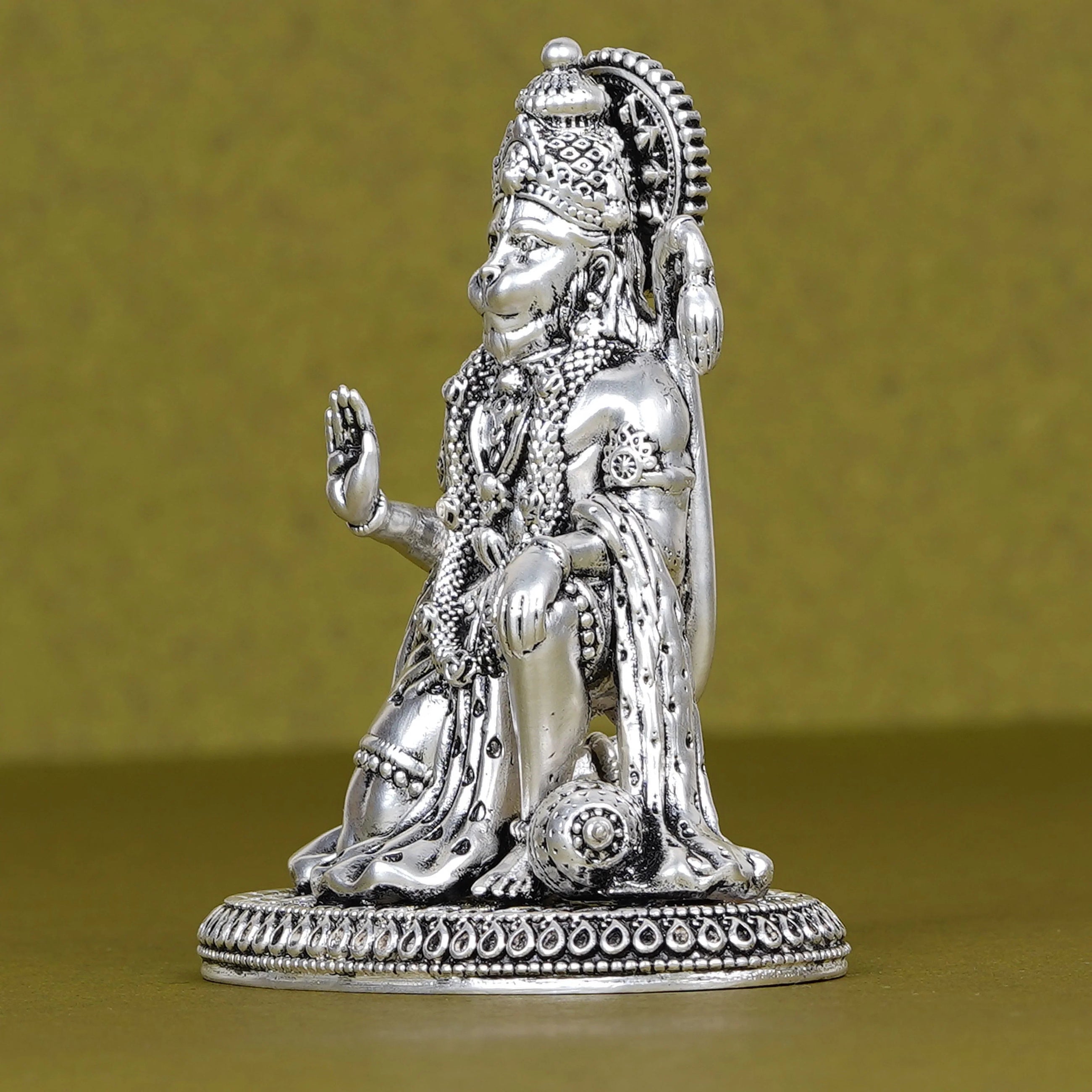 Silver Hanuman idol for car dashboard on plain background, Sabera home decor