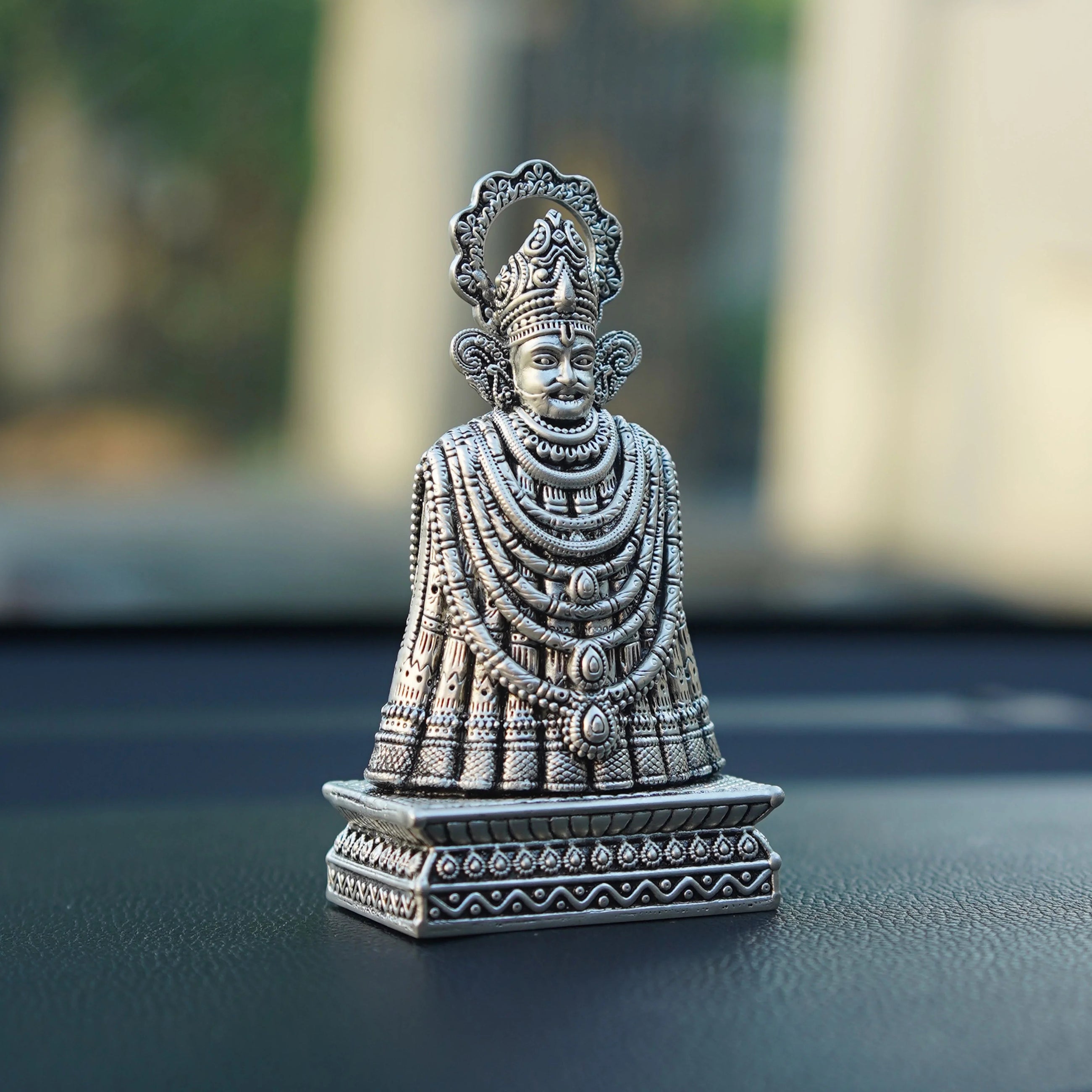 Silver Khatu Shyam Ji idol with intricate detailing on car dashboard, Sabera store