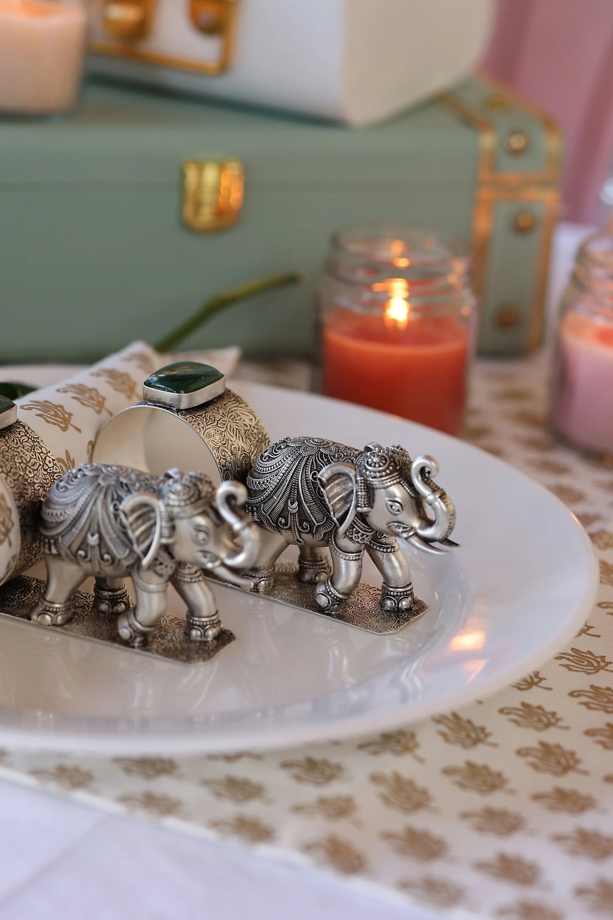 Sabera antique silver elephant napkin rings with stone detail on decorative plate