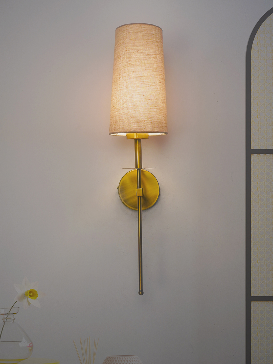 Savoy Long Arm Antique Gold Wall Sconce with Beige Fabric Shade.