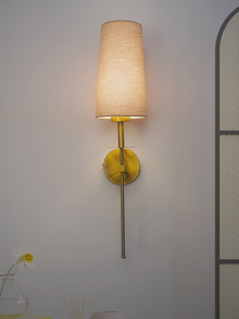Savoy Long Arm Antique Gold Wall Sconce with Beige Fabric Shade.
