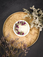 Soy Scented White Candle With White Dry Flowers On Top In A Concrete Jar
