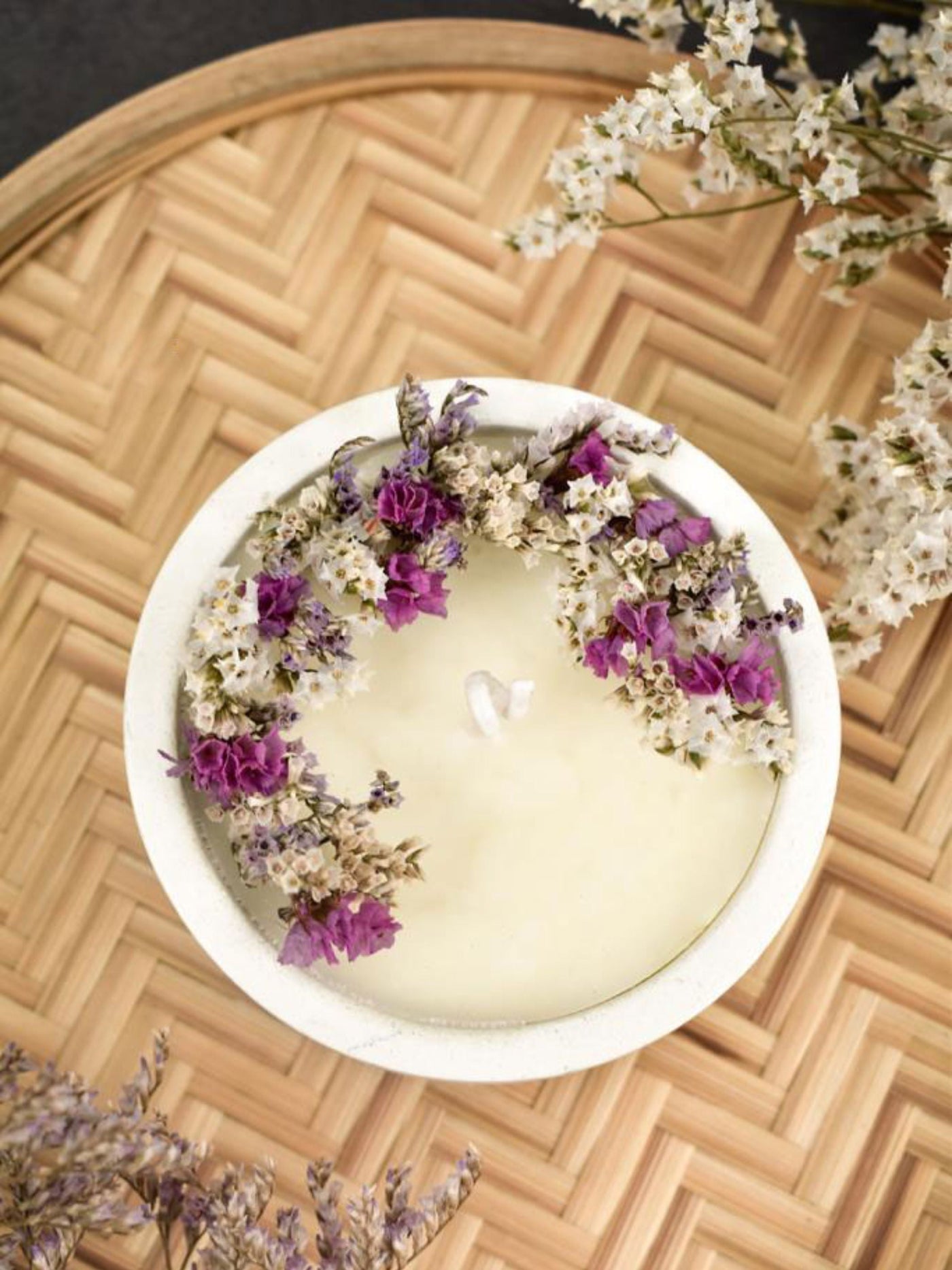 Soy Scented White Candle With White Dry Flowers On Top In A Concrete Jar